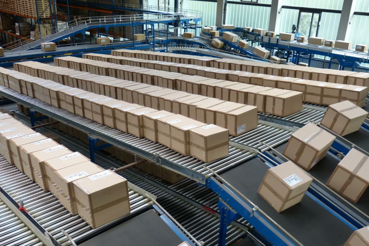 Boxes moving along conveyor lines in a logistics center